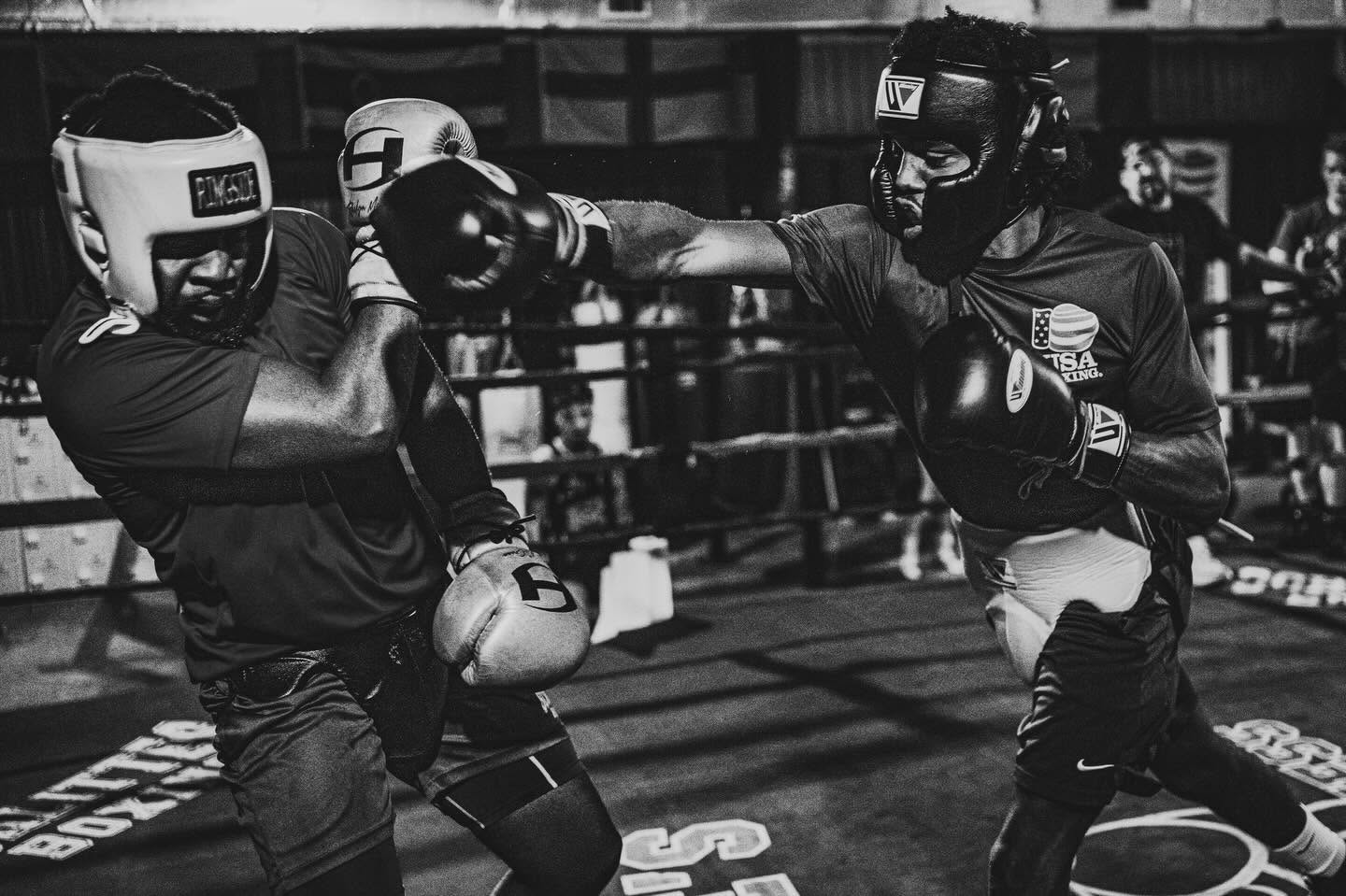 Two boxers sparring in the ring